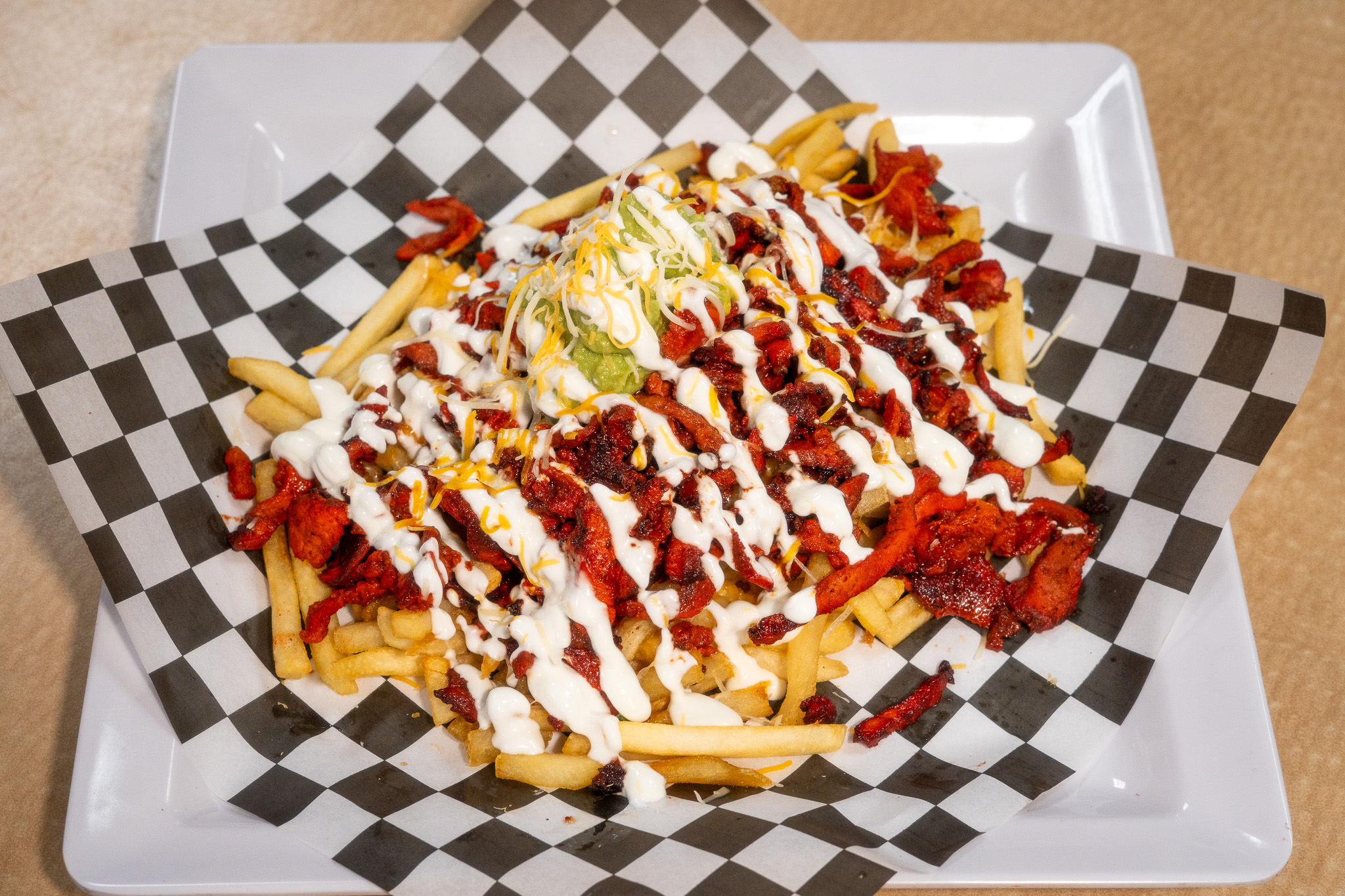Loaded Fries with meat and crema